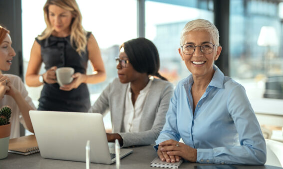 Diverse female employees working together